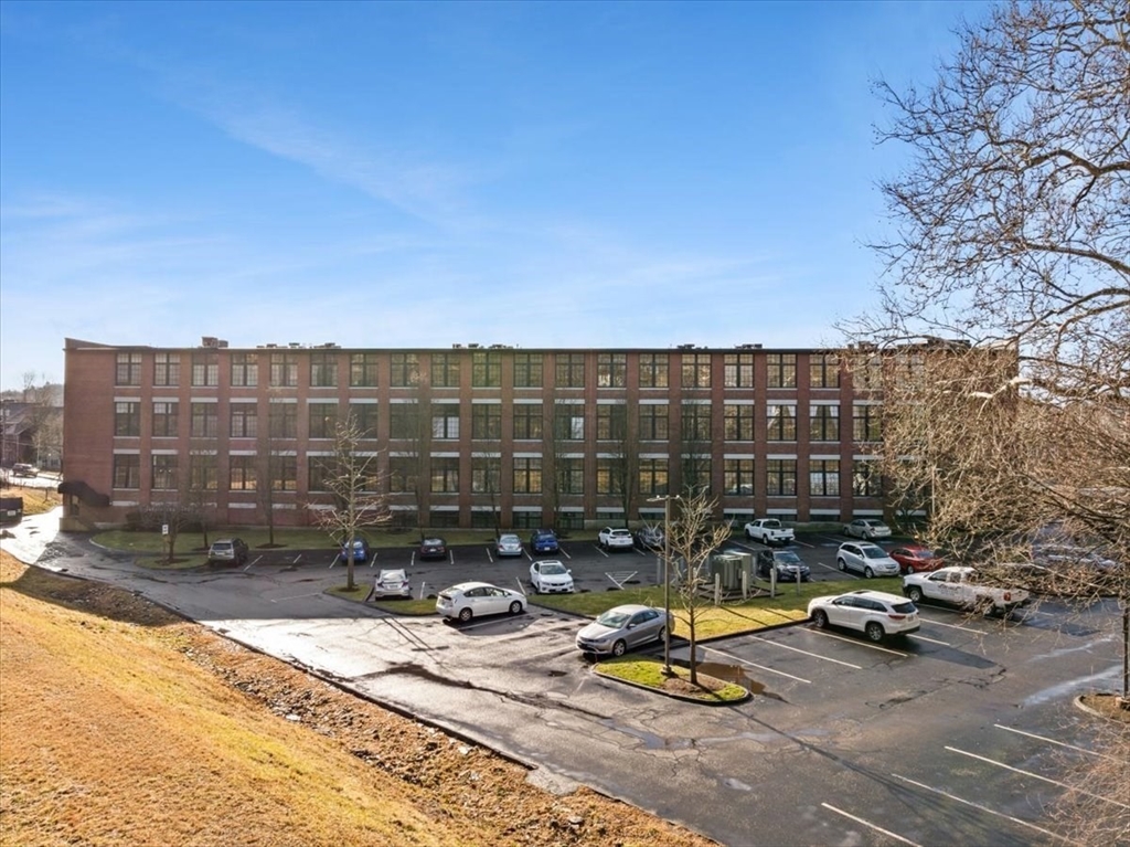 685 Social Street, Unit 215 Woonsocket, RI 02895 - Photo 2 of 40 a view of a patio with a table and chairs