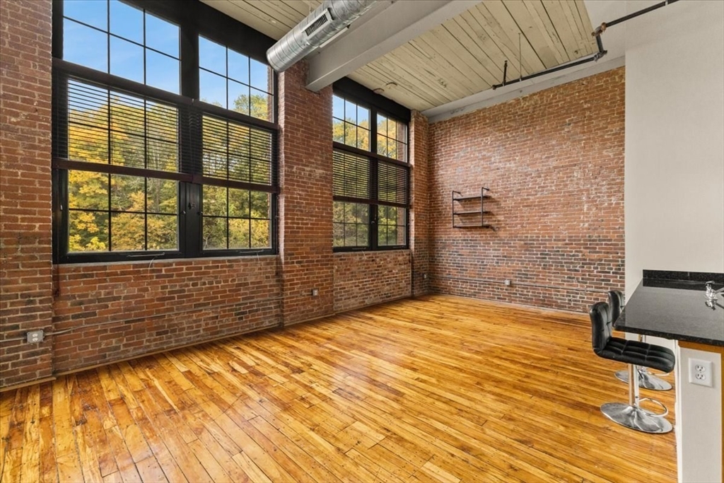 685 Social Street, Unit 215 Woonsocket, RI 02895 - Photo 27 of 40 a view of an empty room with a window