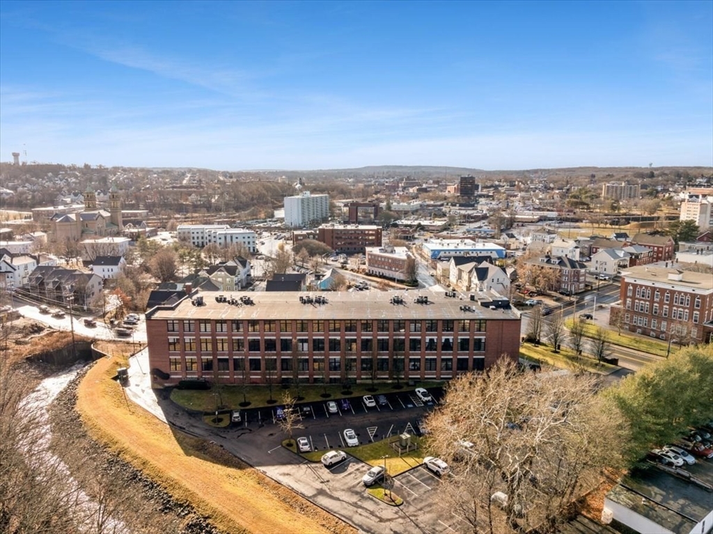 685 Social Street, Unit 215 Woonsocket, RI 02895 - Photo 3 of 40 a view of a large building with a city view