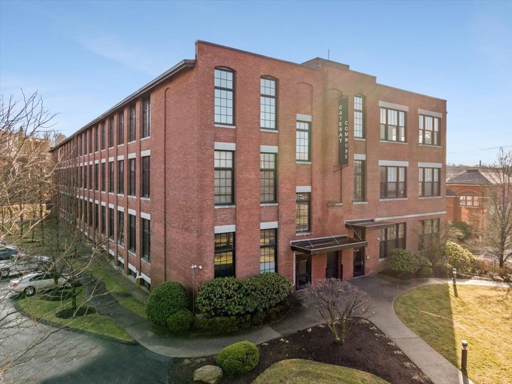 685 Social Street, Unit 215 Woonsocket, RI 02895 - Photo 7 of 40 a view of a building from a patio