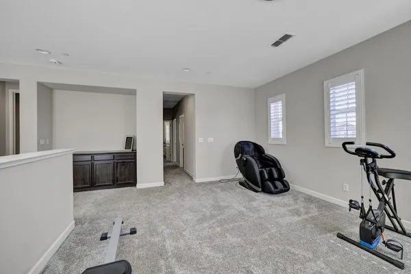 a view of a livingroom with furniture and windows