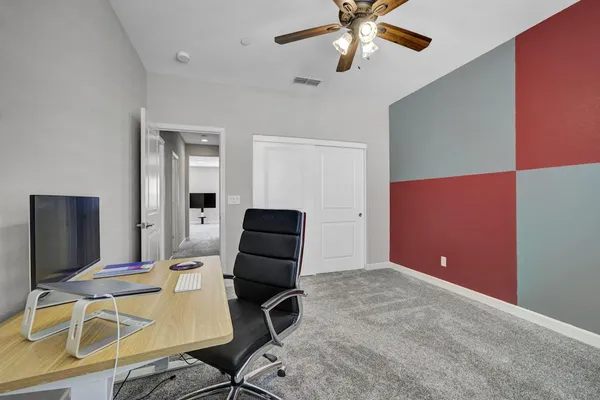 a workspace with furniture and chandelier