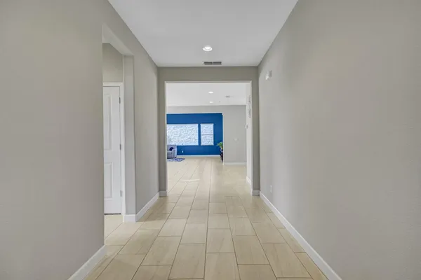 a view of a hallway with a room