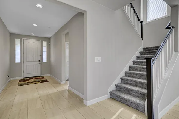 a view of an entryway with staircase