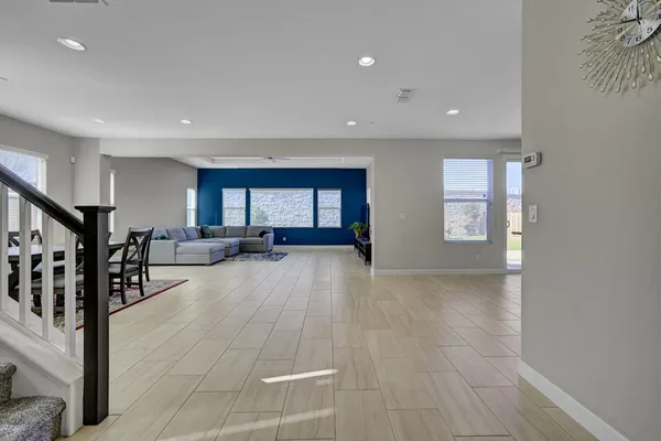 a view of a livingroom with furniture and toys