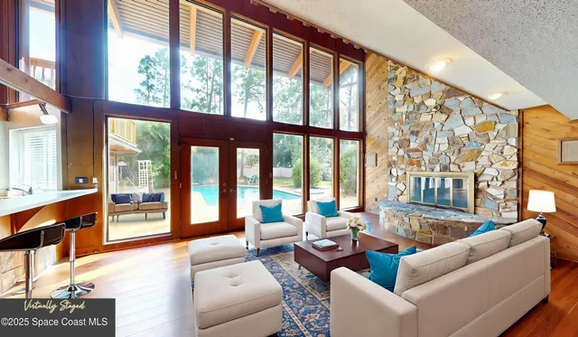 a living room with furniture tv and a window