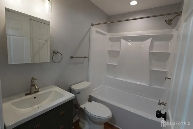 a view of an empty room and wooden floor