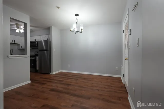 a kitchen with stainless steel appliances granite countertop a stove a refrigerator and a sink