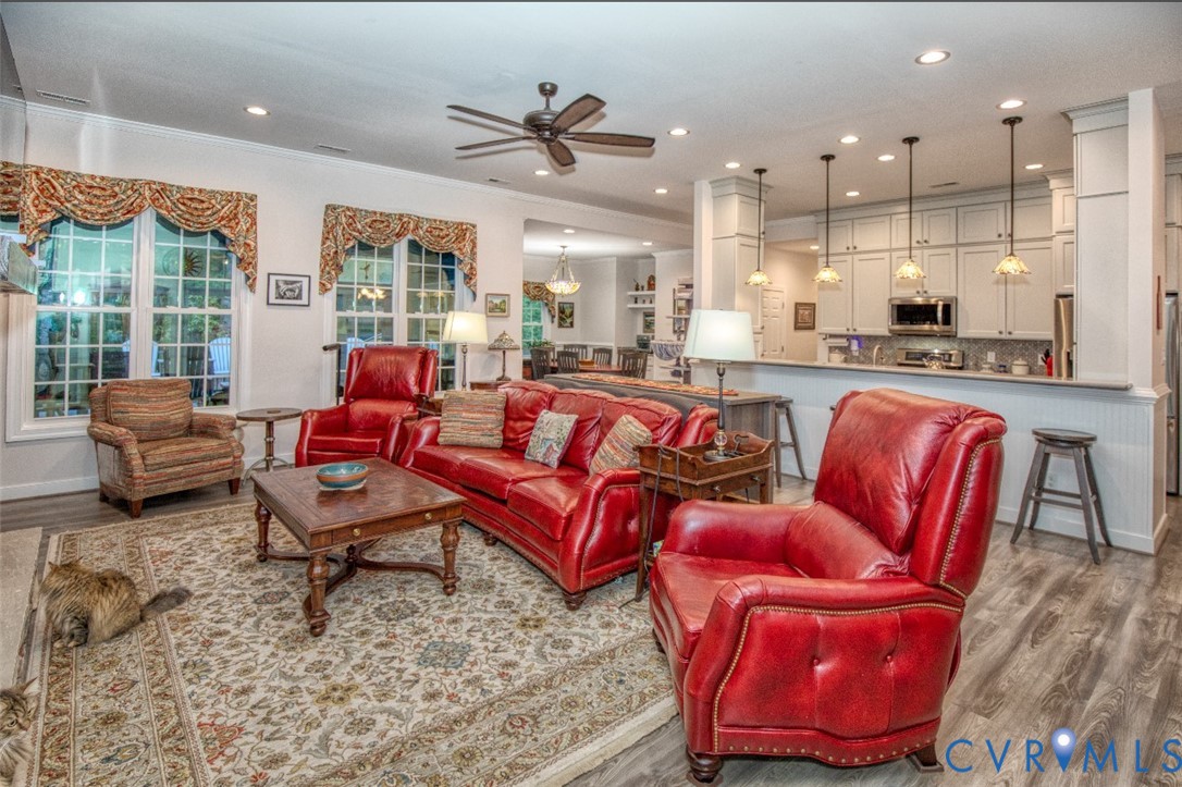 7075 Menzels Road Toano, VA 23168 - Photo 11 of 50 Open-concept living area with wood-finish flooring