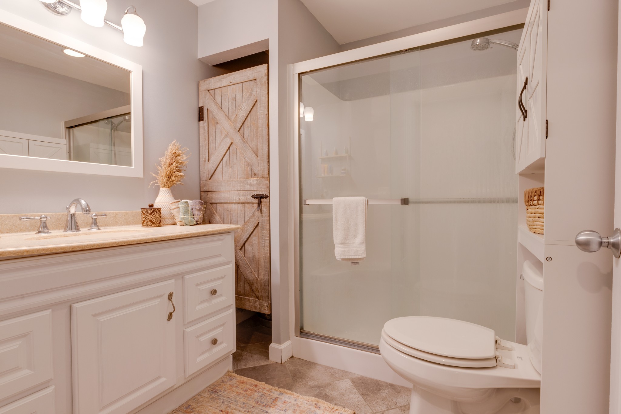 3020 Sylvia Road Dickson, TN 37055 - Photo 16 of 36 a bathroom with a sink a toilet and shower