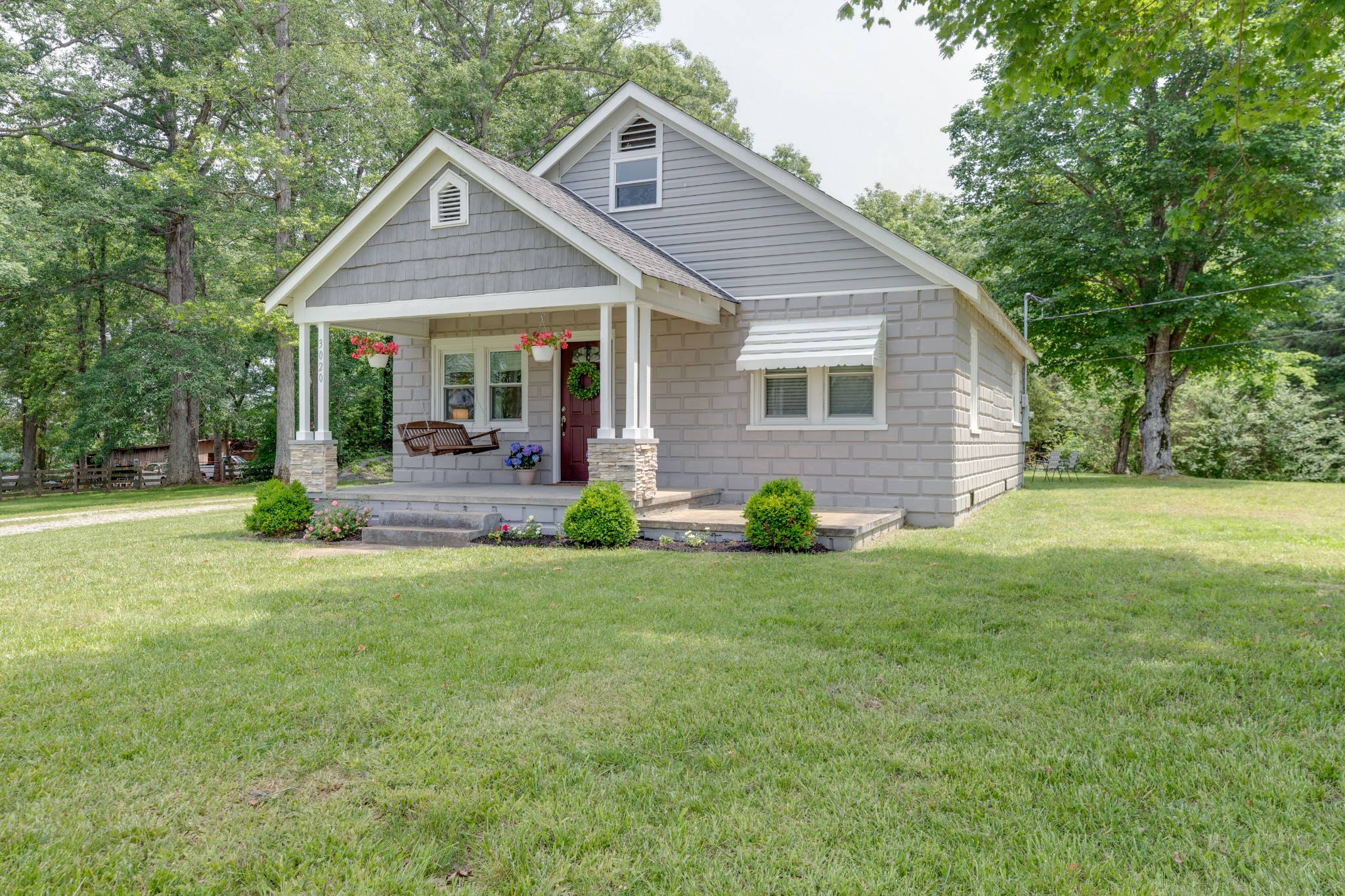 3020 Sylvia Road Dickson, TN 37055 - Photo 2 of 36 a front view of a house with garden