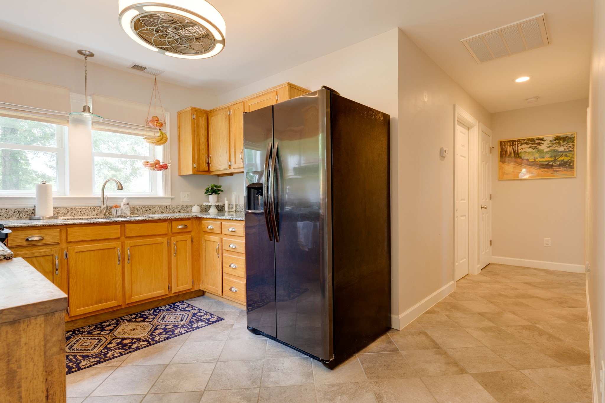 3020 Sylvia Road Dickson, TN 37055 - Photo 21 of 36 a kitchen with stainless steel appliances granite countertop a refrigerator and a sink