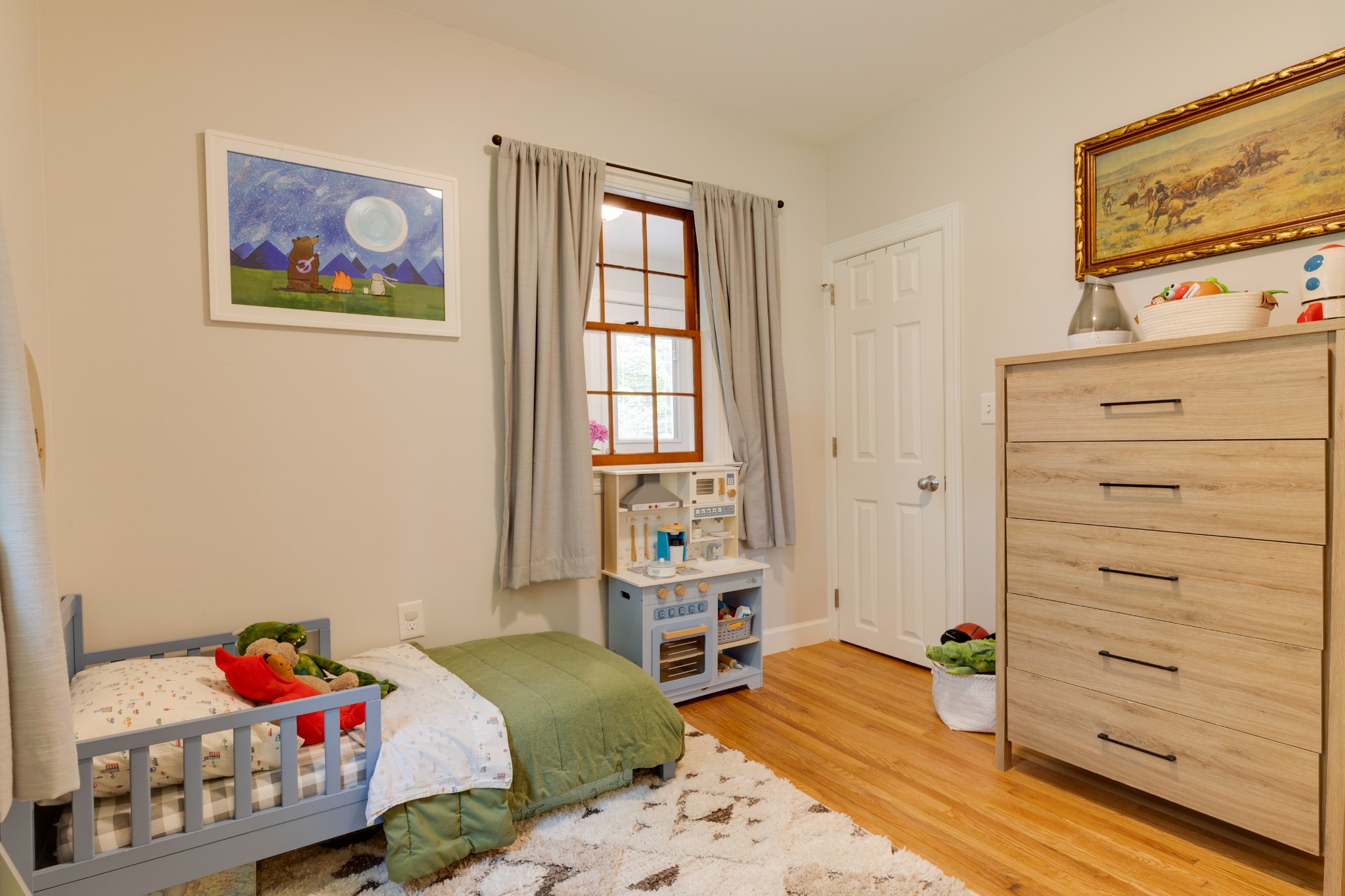 3020 Sylvia Road Dickson, TN 37055 - Photo 29 of 36 a bedroom with a bed and wooden floor