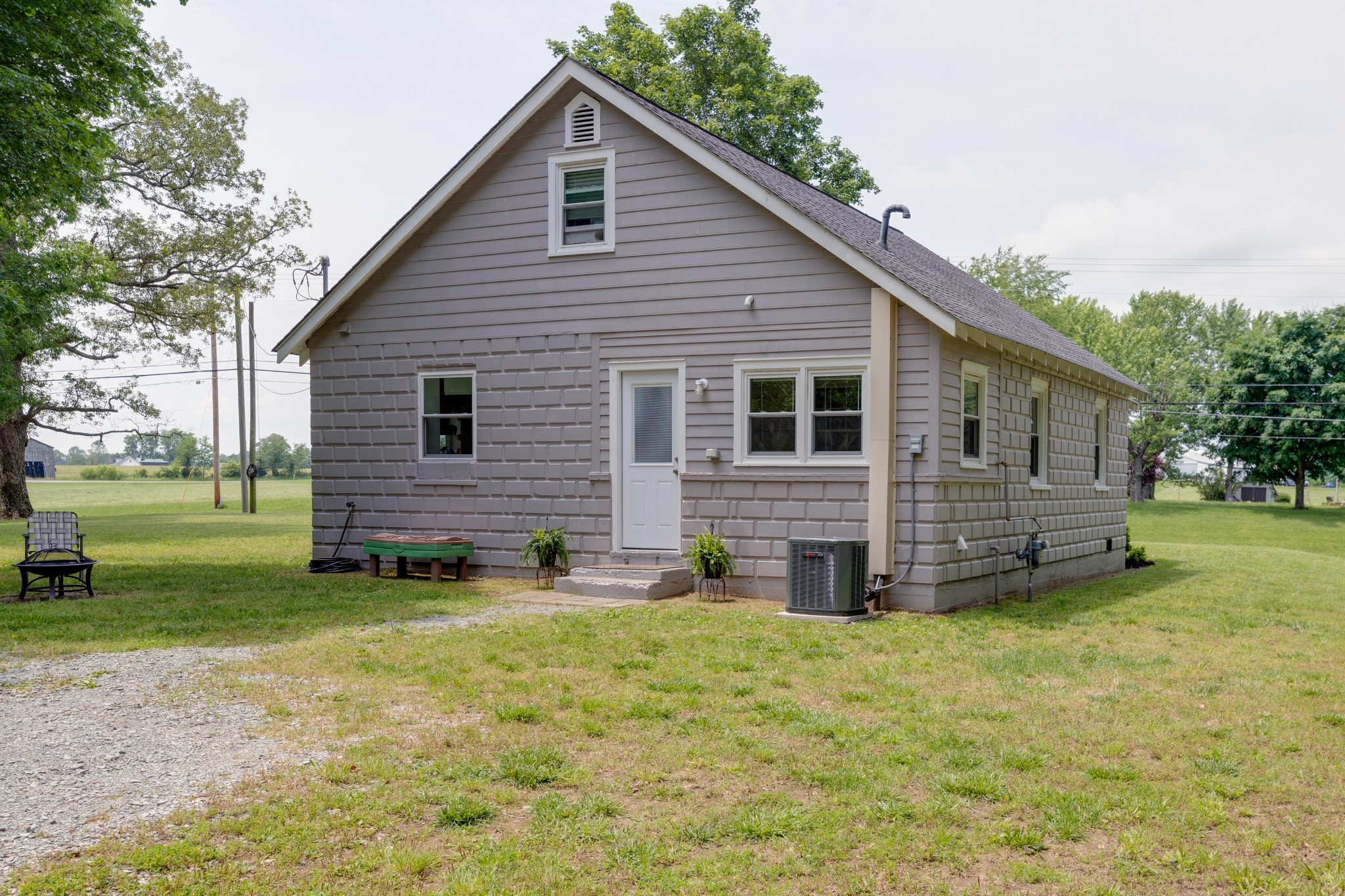 3020 Sylvia Road Dickson, TN 37055 - Photo 31 of 36 a view of a house with a yard and a large tree