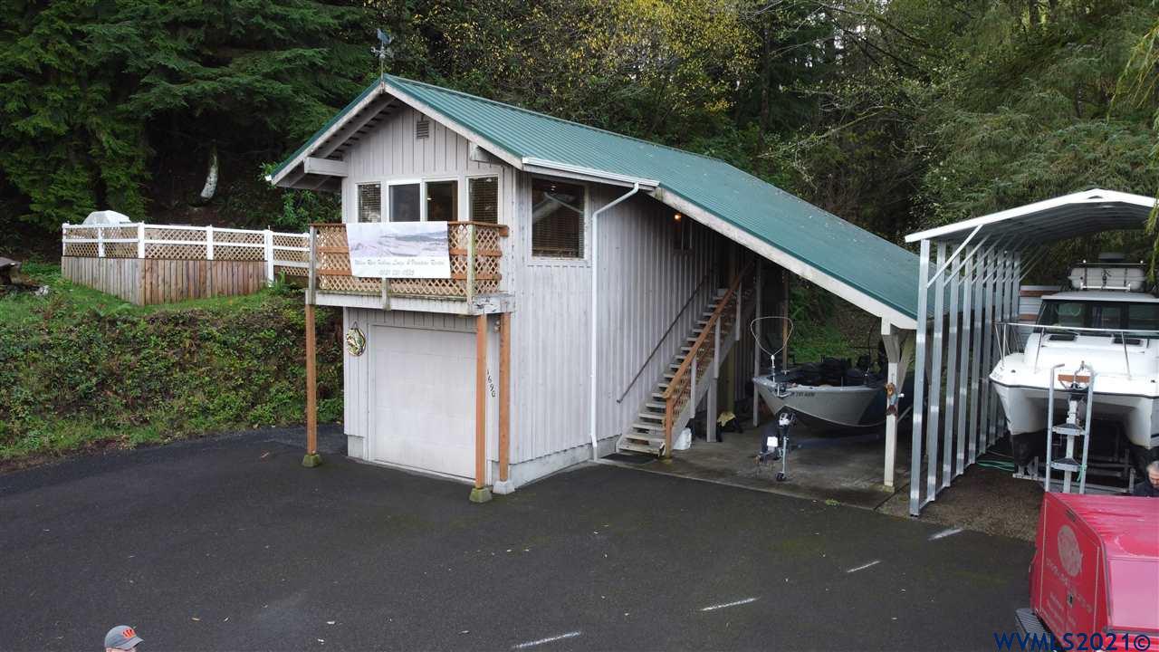 1690 Bayocean Road Northwest Tillamook, OR 97141 - Photo 2 of 25 a view of a house with backyard and sitting area