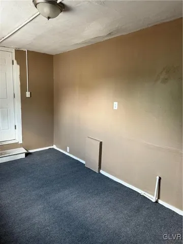 a bathroom with a bath tub with a shower