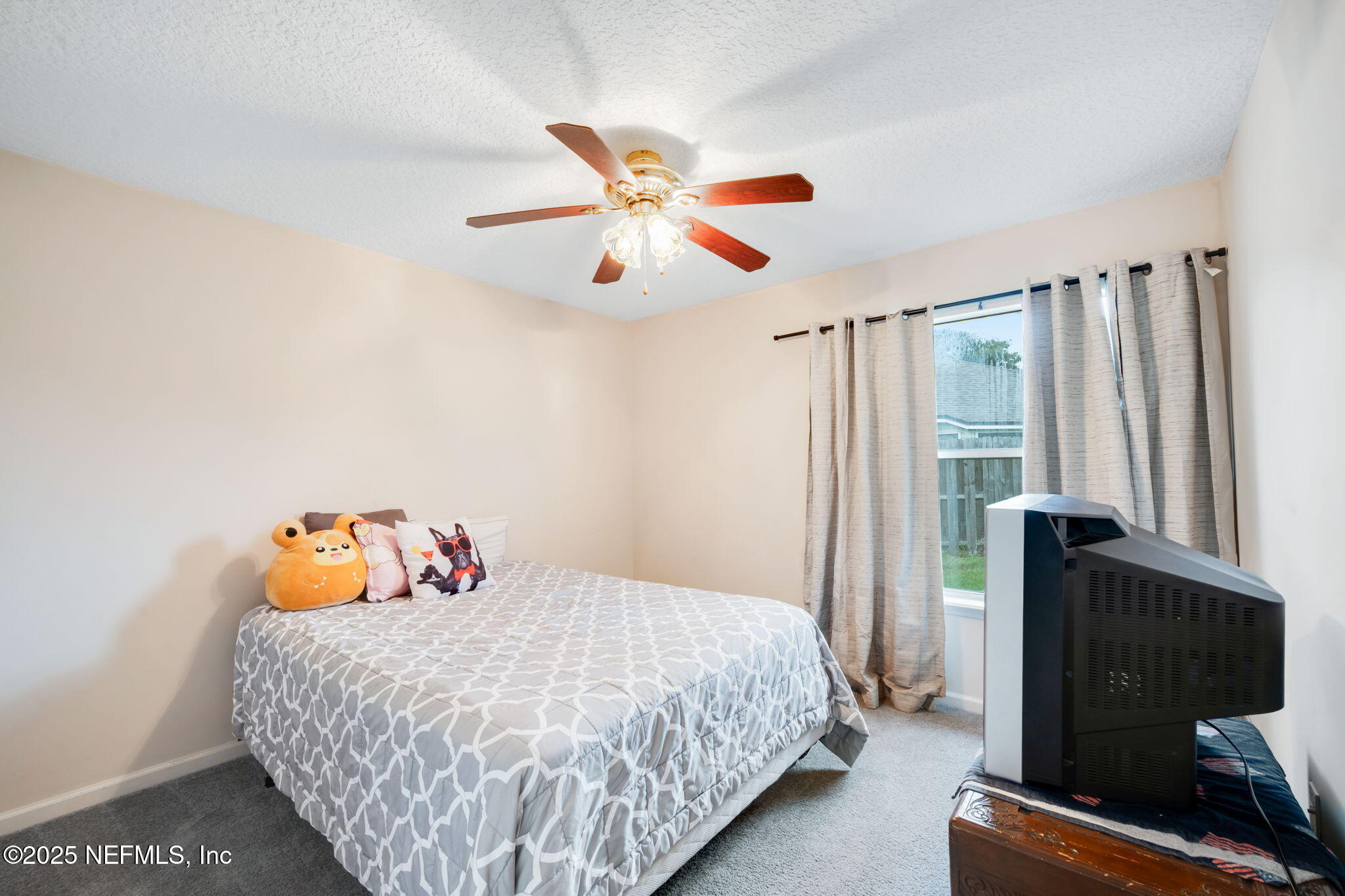 1827 Woodstone Way St. Augustine, FL 32092 - Photo 19 of 31 a bedroom with a bed and wooden floor