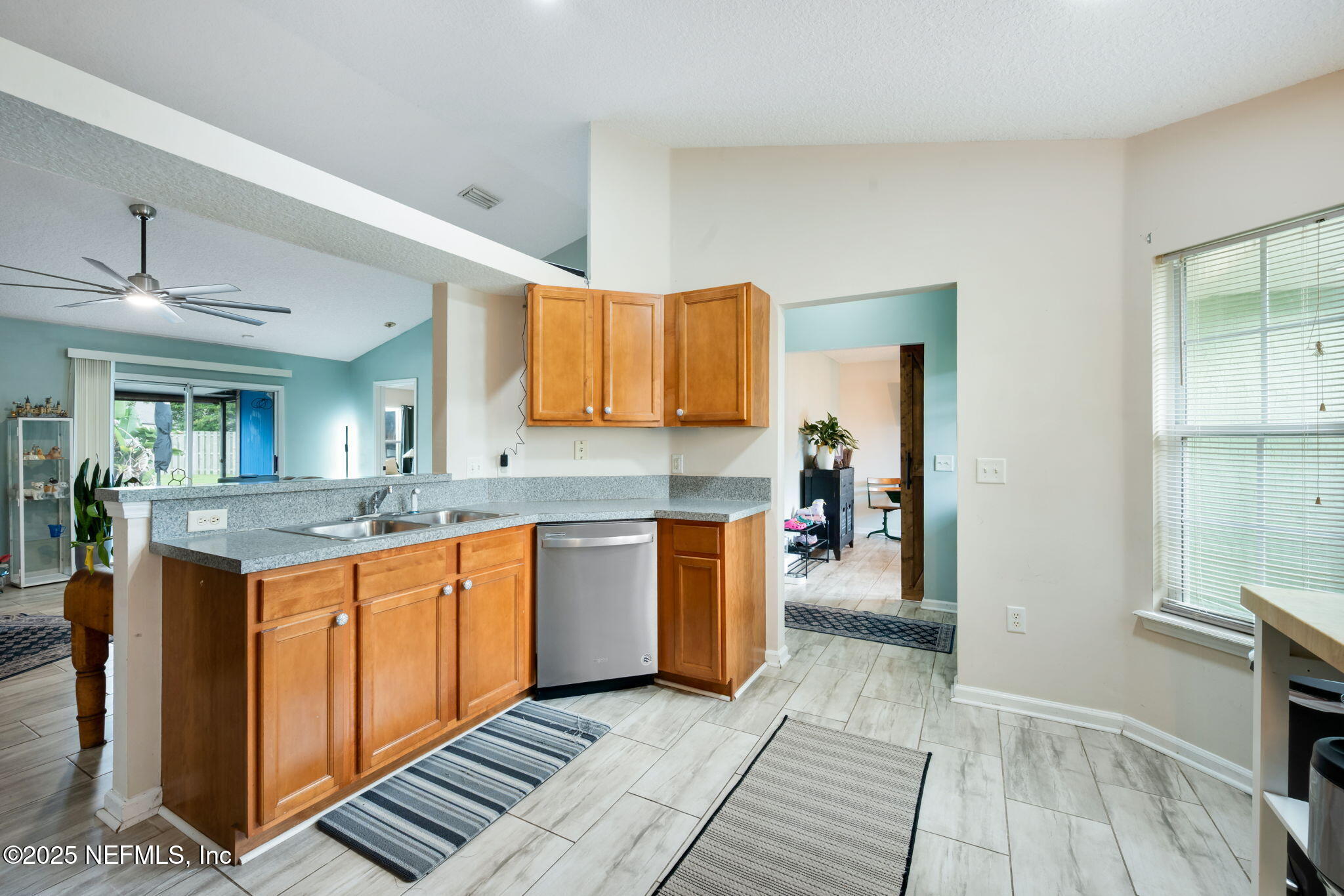 1827 Woodstone Way St. Augustine, FL 32092 - Photo 6 of 31 a kitchen with stainless steel appliances granite countertop a sink and cabinets