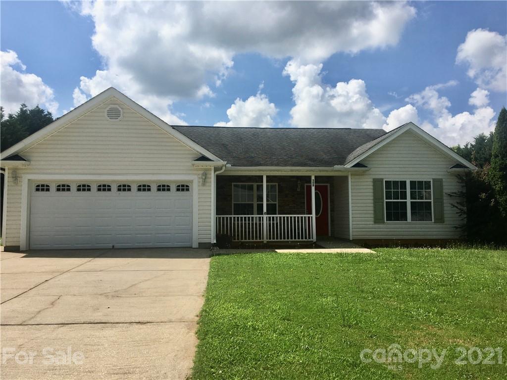 308 Covington Drive Inman, SC 29349 - Photo 8 of 22 a front view of a house with a yard and garage