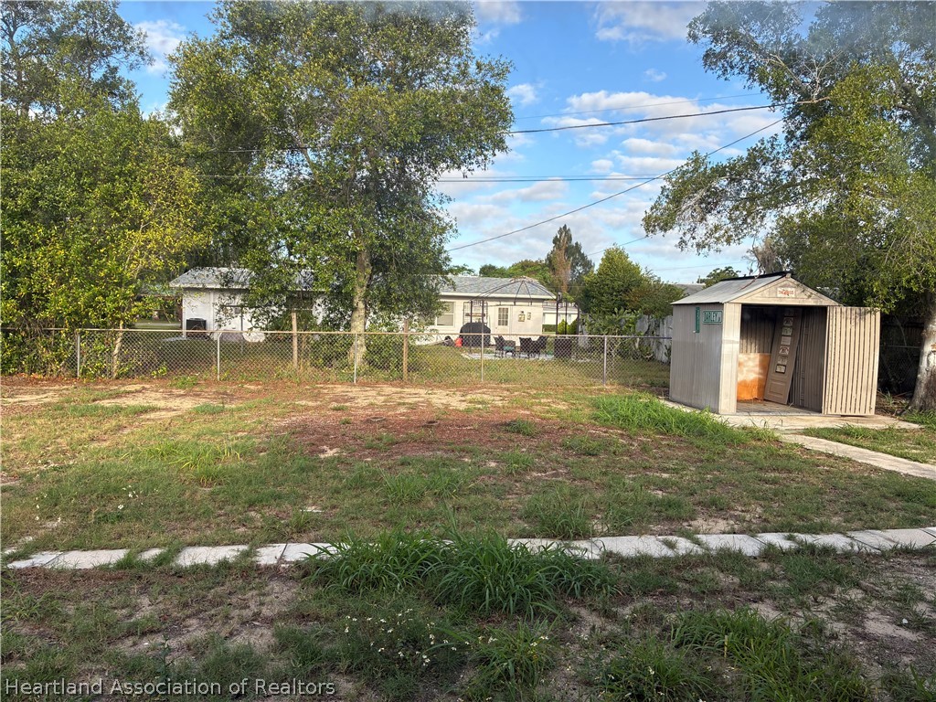 1525 Lagrange Avenue Sebring, FL 33870 - Photo 15 of 16 a backyard of a house with table and chairs