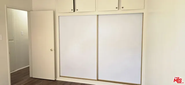 a view of door with wooden floor