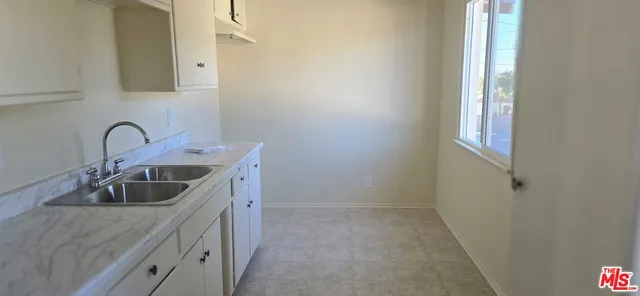 a kitchen with a sink and a window