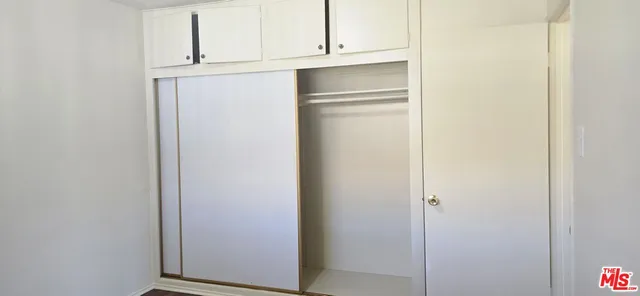 a view of cabinets and wooden floor