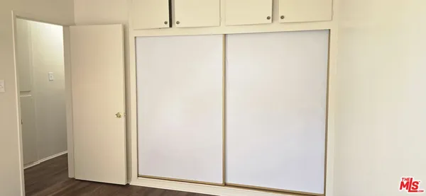 a view of door with wooden floor