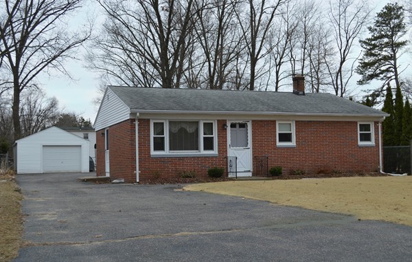 175 Brewster Street Springfield, MA 01119 - Photo 1 of 16 a front view of a house with a yard