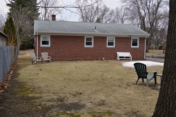 175 Brewster Street Springfield, MA 01119 - Photo 13 of 16 a backyard of a house with table and chairs