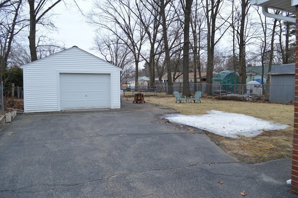 175 Brewster Street Springfield, MA 01119 - Photo 15 of 16 a view of a house with a yard and garage