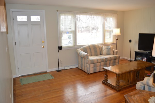 175 Brewster Street Springfield, MA 01119 - Photo 2 of 16 a living room with furniture and a flat screen tv