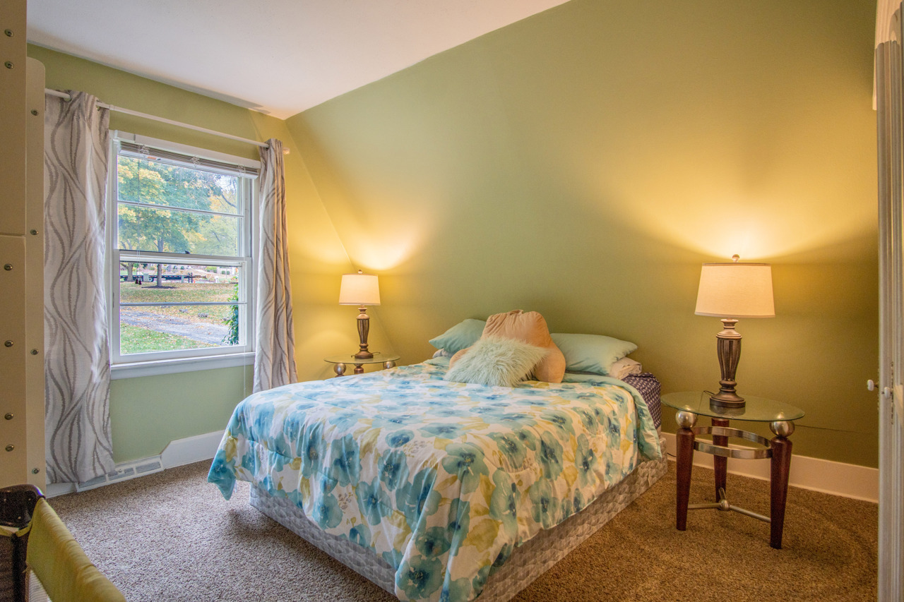 1910 Baintree Road Lake Summerset, IL 61019 - Photo 16 of 42 a bed sitting in a bedroom next to a window
