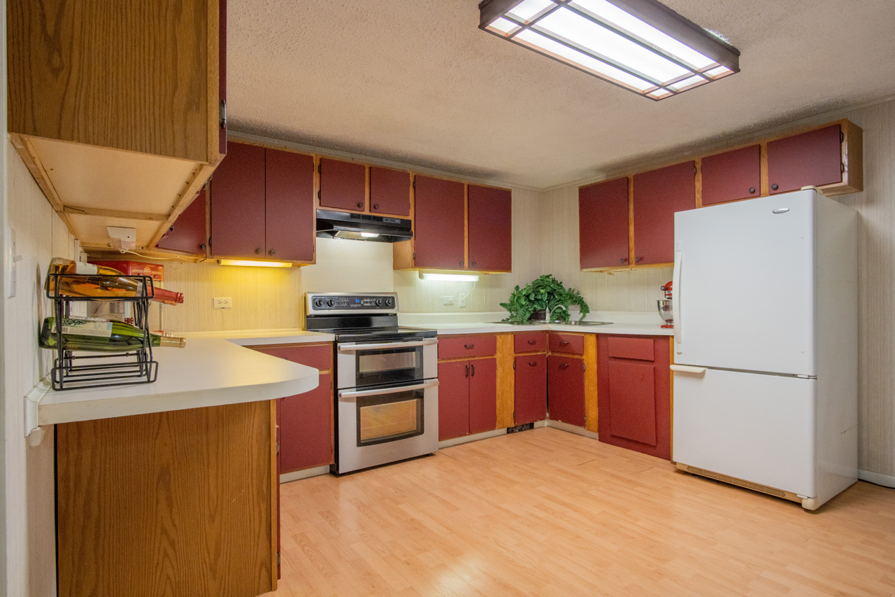 1910 Baintree Road Lake Summerset, IL 61019 - Photo 24 of 42 a kitchen with granite countertop a refrigerator a stove a sink dishwasher and a refrigerator