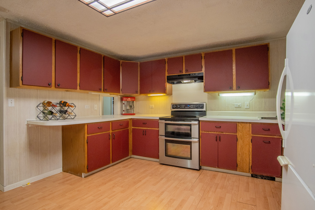 1910 Baintree Road Lake Summerset, IL 61019 - Photo 25 of 42 a kitchen with granite countertop wooden cabinets and stainless steel appliances