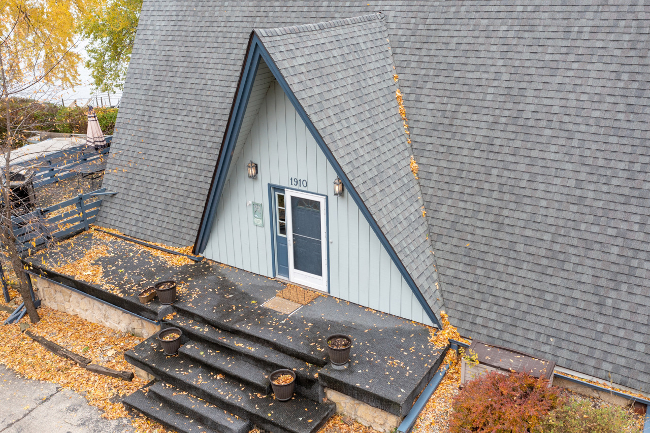 1910 Baintree Road Lake Summerset, IL 61019 - Photo 3 of 42 a view of a house with roof and wooden stairs