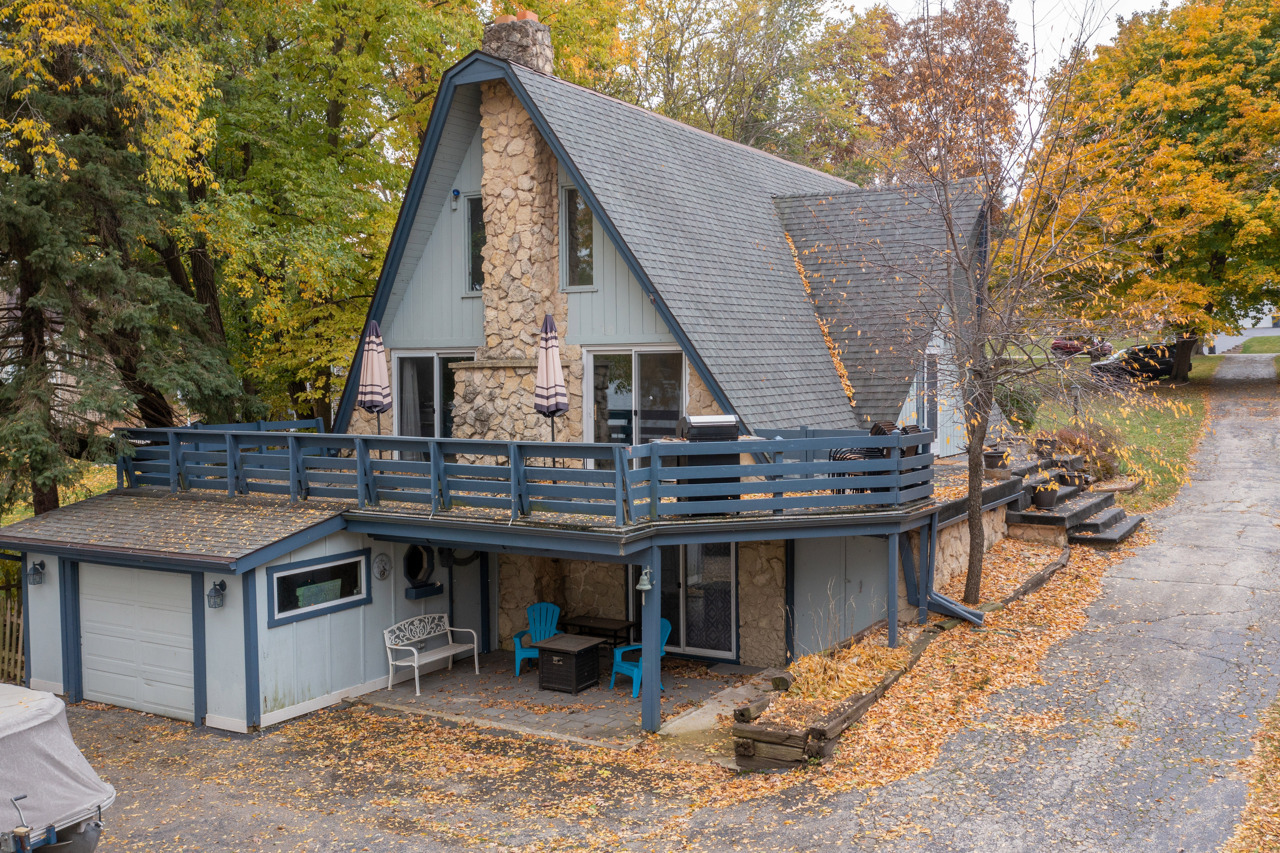 1910 Baintree Road Lake Summerset, IL 61019 - Photo 32 of 42 a view of house with wooden deck and furniture
