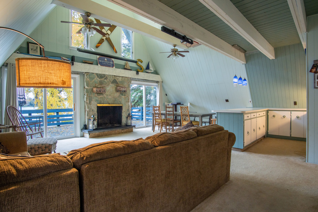 1910 Baintree Road Lake Summerset, IL 61019 - Photo 4 of 42 a living room with furniture a fireplace and a flat screen tv