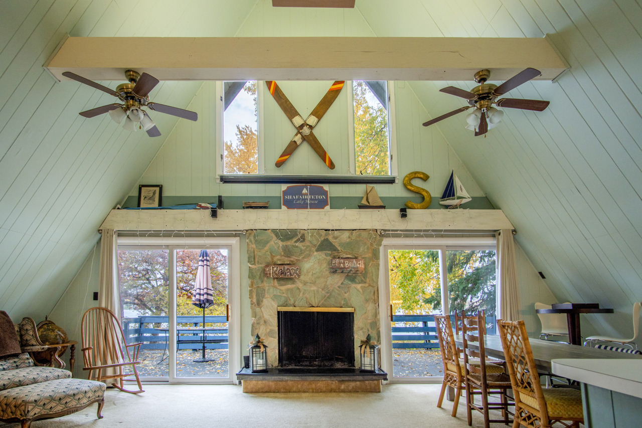 1910 Baintree Road Lake Summerset, IL 61019 - Photo 8 of 42 a living room with furniture and a fireplace