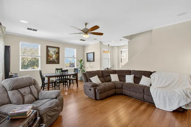 a dining room with furniture and window