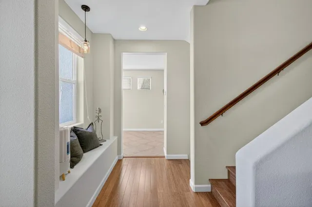 a kitchen with stainless steel appliances granite countertop a refrigerator a stove and a sink