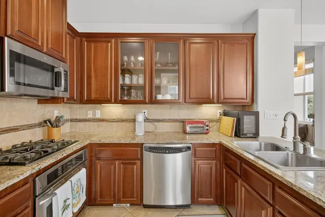 a view of a livingroom with furniture and windows