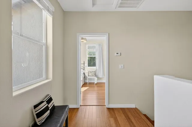 a bedroom with a bed and a view of bathroom