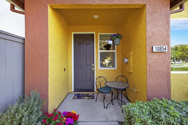 a view of a livingroom with wooden floor and a window