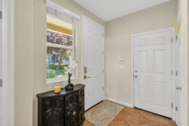 a bed sitting in a bedroom next to a window