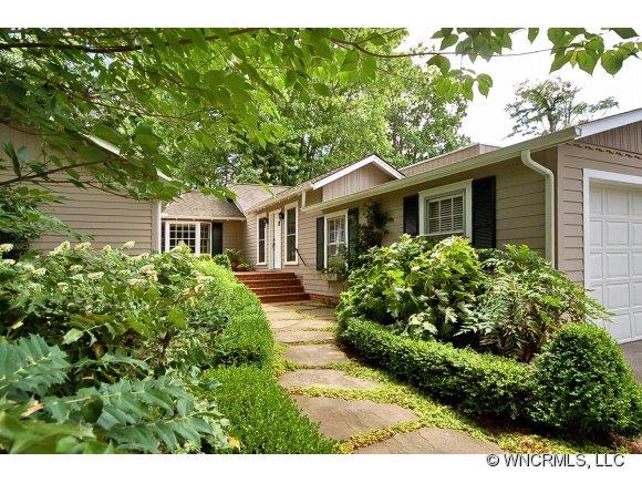 1964 County Road Lake Junaluska, NC 28745 - Photo 1 of 12 a front view of a house with a garden