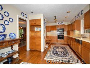 1964 County Road Lake Junaluska, NC 28745 - Photo 5 of 12 a kitchen with stainless steel appliances granite countertop a refrigerator and a sink