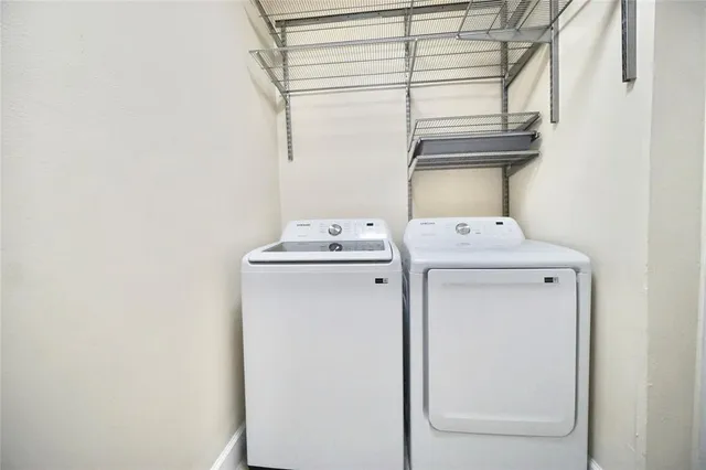 a utility room with dryer and washer