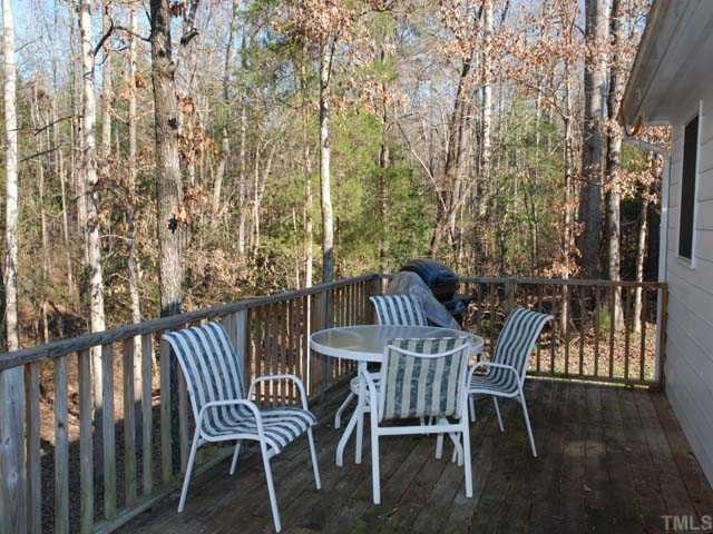 2316 Anihinga Court Raleigh, NC 27616 - Photo 3 of 4 a view of a table and chairs in the balcony