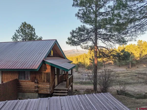 a backyard of a house with wooden floor